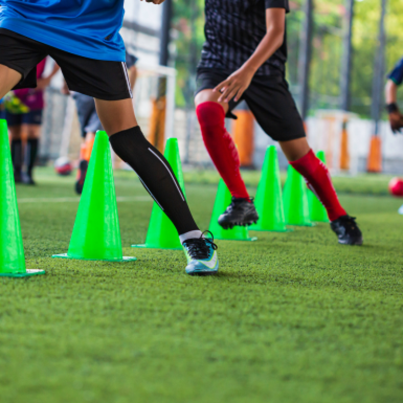 soccer-ball-tactics-grass-field-with-cone-training-children-running-skill-soccer-academy